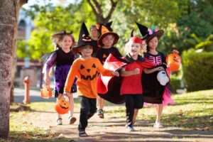Kids outside going trick-or-treating